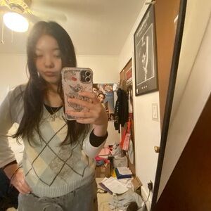 White and blue patterned sweater vest